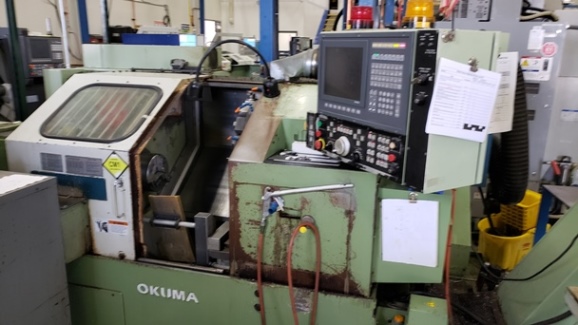 Okuma LB15, OSP 5020L, 8 Chk, 2 , Tailstock, Chip Conveyor, Parts Catcher