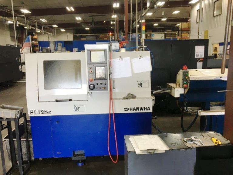 1/2 , HANWHA SL12E, FANUC 0IT, 2002, 6OD/5ID-BW, MTA Magazine BF