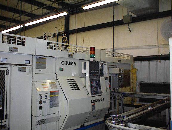 Okuma LCC-15-2S, OSP-7000L, 8 Chk, 2 1/2 , 2-Spindle, 4 Axis, Twin Saddle W/Part Loader/Flip Systems, Gantry loaders, Stack tables, Chip, etc - New 1999