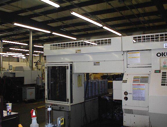 Okuma LCC-15-2S, OSP-7000L, 8 Chk, 2 1/2 , 2-Spindle, 4 Axis, Twin Saddle W/Part Loader/Flip Systems, Gantry loaders, Stack tables, Chip, etc - New 1999