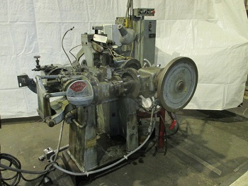 U.S. BAIRD #1 FOUR SLIDE MACHINE WITH STRAIGHTENER AND COIL STAND