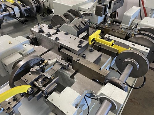 NILSON 751 FOUR SLIDE MACHINE - REBUILT / DUAL SLIDE - COINING