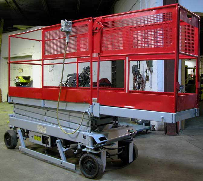 500 Lb MEC Manlift, 27 x 7' Platform with 42 Fold Down Extension, 19'9 Lift