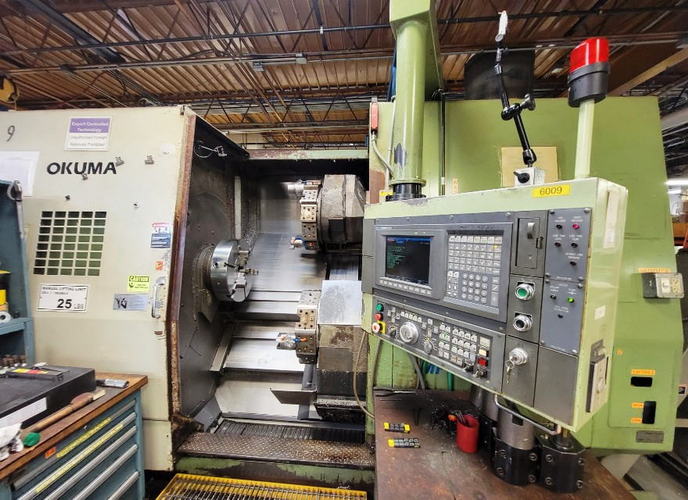 OKUMA LU-35 4-Axis CNC Turning Center, OSP-7000 Control, 12/10-Pos Dual Turret